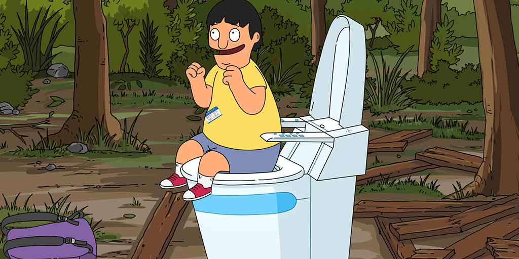 gene sitting on a toilet